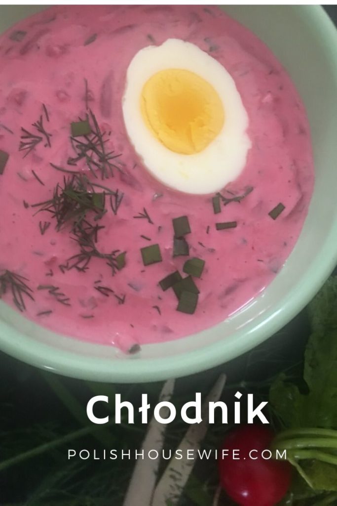creamy beet soup topped with half a hard boiled egg and chopped dill and chives