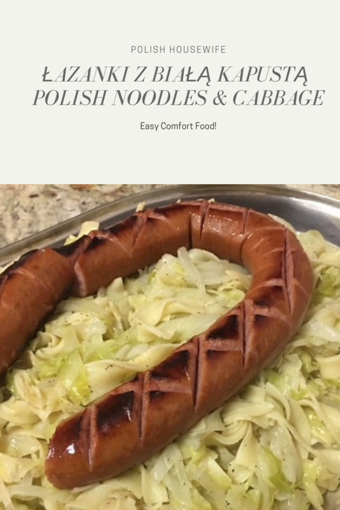 Noodles and cabbage topped with Polish sausage