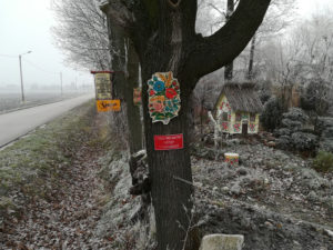 a tree in the Polish village of Zalipie decorated with a painted floral motif