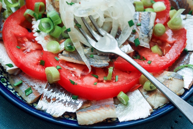 pickled herring with tomato and onions