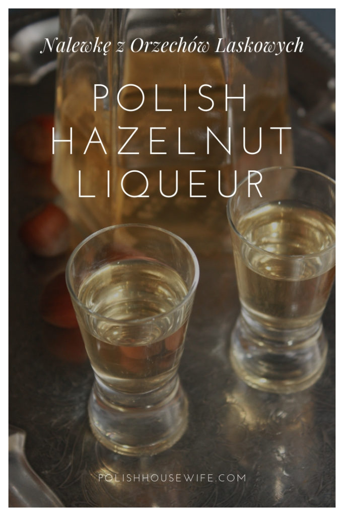 Polish hazelnut liqueur in two shot glasses on a silver tray with a bottle in the background