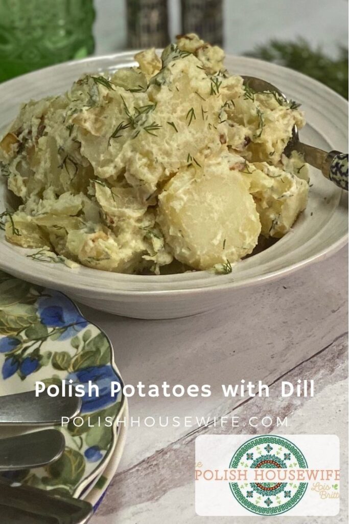 Polish potatoes with dill in a white bowl