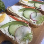 Polish kanapki, open face sandwiches on serving board